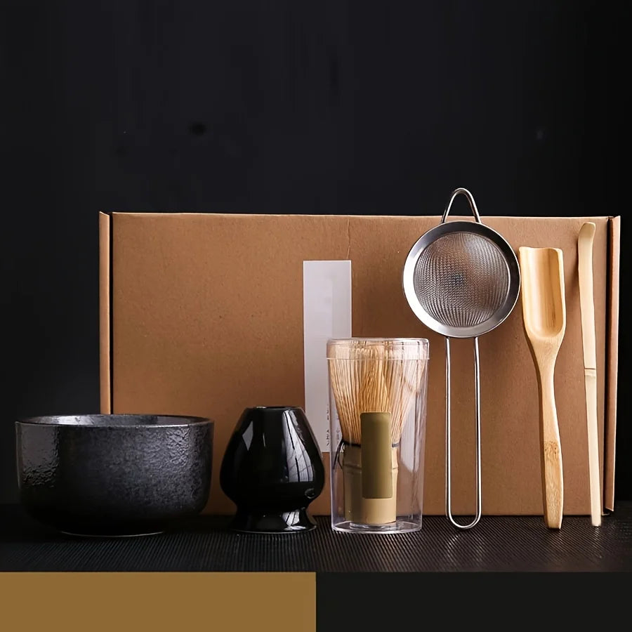 Matcha gift set with matte black bowl, whisk holder, bamboo whisk, sieve, scoop and spoon in kraft gift box