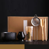 Matcha gift set with matte black bowl, whisk holder, bamboo whisk, sieve, scoop and spoon in kraft gift box